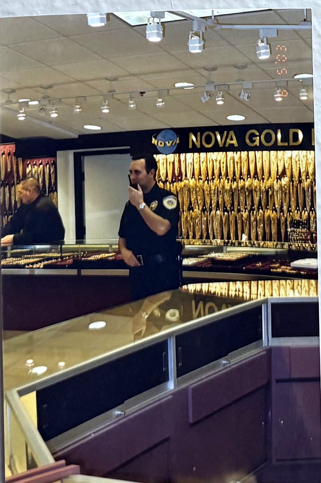 Officer monitoring a high-value retail counter